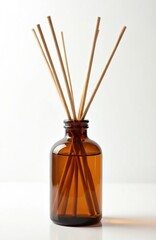 Amber glass bottle with scented liquid and reeds for aromatherapy. Home fragrance diffuser, creating relaxing aroma and home freshness. Natural air freshener concept for interior decor, luxury hotels.