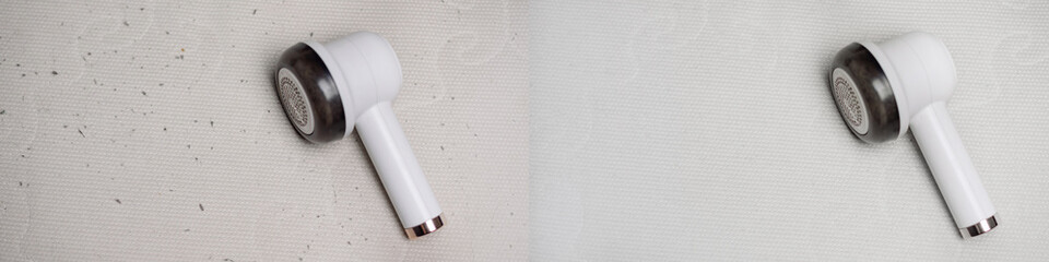A white fluff remover device is placed on a light surface. The device has a sleek design with a...
