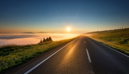 keep climbing leads to a bright horizon over a misty road at sunrise