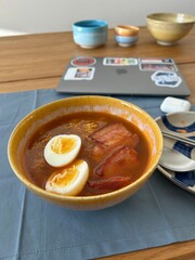 Noodle soup with eggs and pork belly