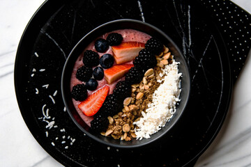 Bowl of fruit and granola, healthy breakfast

