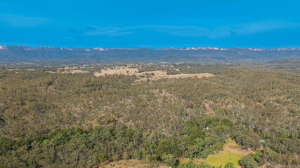 Drone aerial photograph of the widest canyon in the world the Capertee Valley in Wollemi National Park in the Central Tablelands of NSW, Australia.