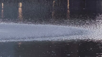 Tokyo, Japan - July 12, 2025: Slow-motion of fountain in a park in the early Morning in Tokyo, Japan