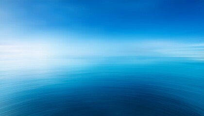 Obraz premium a blurry blue background the sky and water with a gradient that transitions from light blue to dark blue