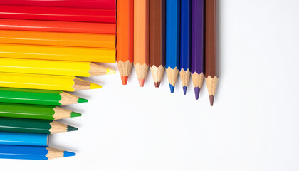Flat Lay of Colored Pencils in Rainbow Order on White Desk Background
