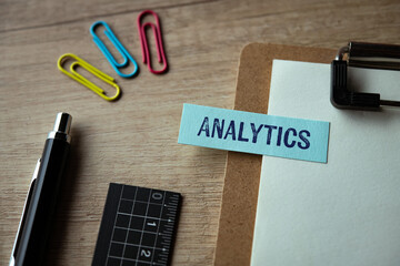 There is sticky note with the word Analytics. It is as an eye-catching image.