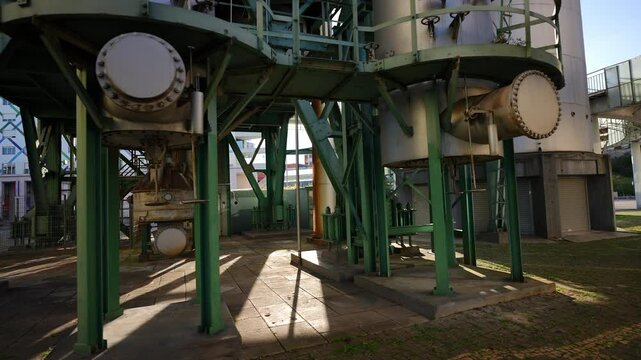 Bottom section of Chamine da Refinaria da GALP with visible pipes tanks valves and industrial details in Lisbon Parque das Nacoes