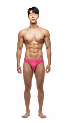 Fototapeta premium A fit young Asian male model poses confidently against a white backdrop. He wears a blue underwear, highlighting his toned physique in a clean, stylish fashion look. 