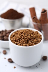 Granulated instant coffee and beans on light table, closeup