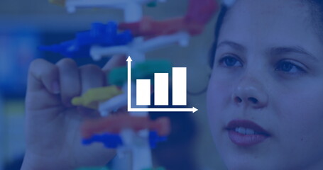 Student assembling molecular model in science lab, with colored connectors and rods, copy space
