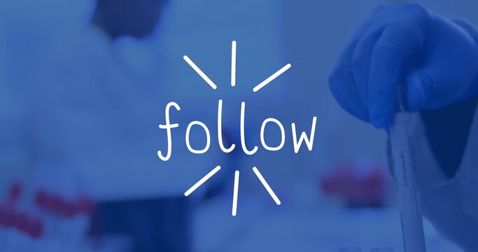 Showing gloved hand holding clear test tube at lab, with red-capped vials, follow text, copy space