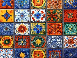 Colorful ceramic tiles featuring intricate floral and geometric patterns in vibrant orange, blue, green, and yellow hues arranged in a grid