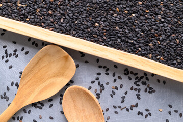 Black sesame seed with wooden spoon, Healthy eating, Top view