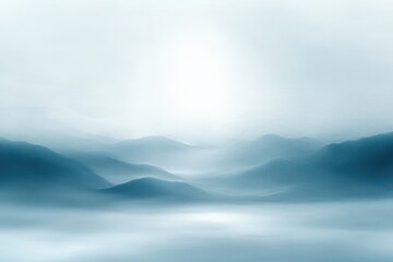 Calm and serene misty blue mountain landscape with soft light creating a peaceful and tranquil atmosphere