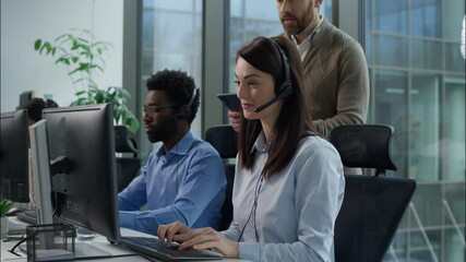 Call center inspection multiethnic operators working online consulting helpline customer support at office Caucasian boss checking business work success talking coworkers Indian African agents headset - Powered by Adobe