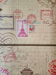 Vintage Postal Theme Eiffel Tower, Stamps, and Ephemera on Textured Surface