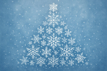A christmas tree formed by snowflakes on a light blue background with falling snow all around the tree