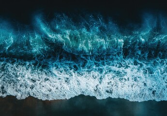 An aerial shot depicts ocean waves crashing on a dark shoreline, showcasing a dynamic contrast between the vibrant blue-white water and the deep, shadowy coast