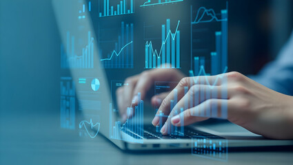 Hands typing on laptop with data overlay visualization