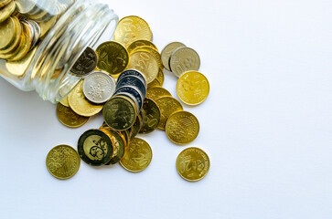 Coins pouring out from a glass jar with customizable space for text or ideas