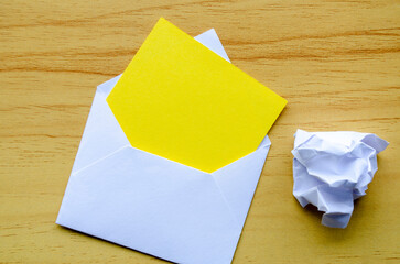 White notepad with envelope and crumpled paper with customizable space for text or ideas. Resignation concept