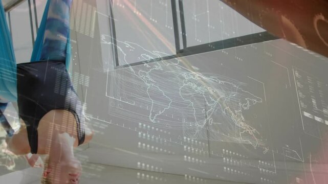 Yoga partners looping knees into silk hammock, inverting torsos balancing with data maps flowing
