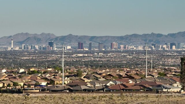 Distant telephoto view of Las Vegas Strip skyline framed by Nevada mountain range