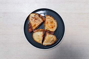 A plate of kimchi bacon sandwich.