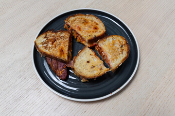 A plate of kimchi bacon sandwich.