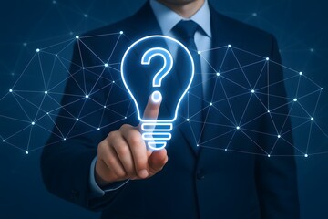 Businessman touching a glowing light bulb with a question mark inside symbolizing innovation