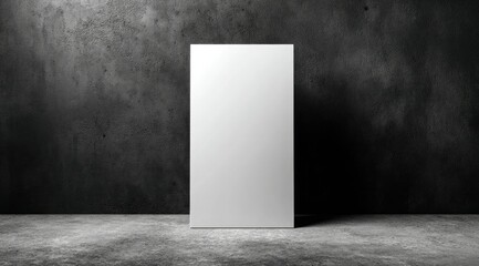 A blank, vertical rectangular sign stands in a dark, grungy room against a textured concrete wall and floor.  The sign is brightly lit, creating a stark contrast