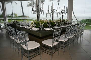 table set in ballroom, elegant wedding reception table with candlesticks, luxury dinner arrangement...