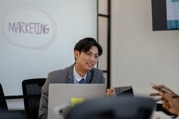 businessman is sitting working in a private office, sales promotion planning staff is writing a plan to present in a meeting, company work environment,