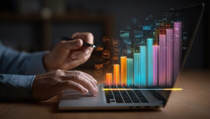 Person using laptop, holographic graph overlay
