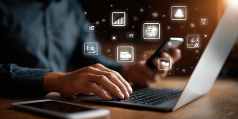 Person using laptop and phone, digital icons overlay
