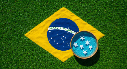 Fototapeta premium The national flag of Brazil, featuring a green field with a yellow diamond and a blue globe containing stars and the motto 