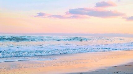 Fototapeta premium Soft pastel sunset painting the sky over a calm ocean beach, with gentle waves lapping the shore. The sky blends hues of pink, blue, and purple, while the water mirrors the serene colors, 