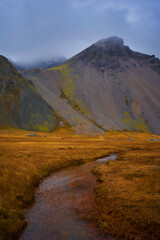 Storm over vestrahorn, stokksness, iceland, in autumn season for road trip travel concept.