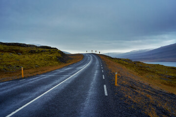 Moody stormy weather sky with empty road in iceland , Road trip travel in Iceland.