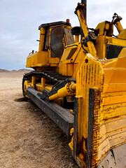 Close up from the side of  heavy old rusty mining vehicle out of work standing for exhibition on the coast of Peru in San Juan de Marcona © K&M FEHR