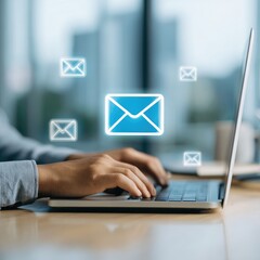 Person typing on laptop, email icons overlay