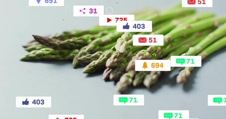 Floating badges appearing around asparagus after still moment swirling counts showing engagement - Powered by Adobe