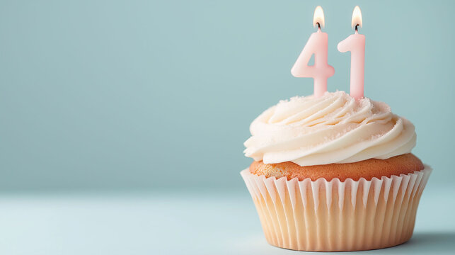 Cupcake to celebrate a birthday or anniversary with candles in the shape of the number 41
