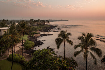 stunning tropical sunsets over ocean in various countries showcasing vibrant colors and serene landscapes