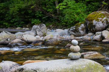 Rocks stacked on each other in the river