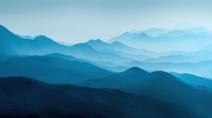 Fototapeta premium Serene layered mountain ranges in blue tones misty horizon landscape background