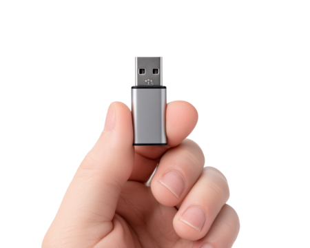 Hand holding a small silver usb adapter