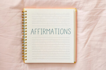 Affirmation journal notebook handwritten motivation inspiration spiral page self care positive mindset fill open spiral notebook page with handwritten affirmations creating calming and uplifting