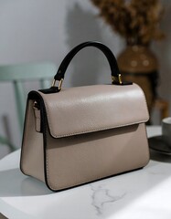 Beige Leather Handbag with Elegant Fashion Accessory.
