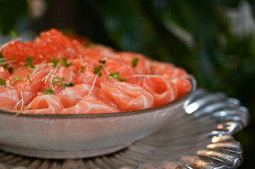 salmon tartare, salmon tartare with guacamole, fresh salmon, Japanese food, Japanese cuisine, haute cuisine, salmon ceviche in an ice bowl for an elegant buffet, gourmet salmon tartare served cold on